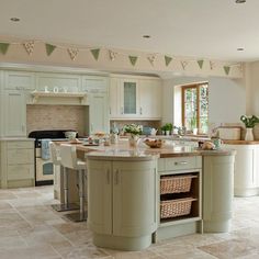 a kitchen filled with lots of counter top space next to a stove top oven and sink