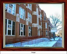 an apartment building in winter with snow on the ground