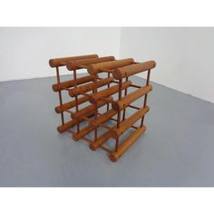 four wooden racks stacked on top of each other