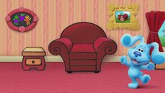 the blue dog is running in front of a red chair and pink carpeted wall