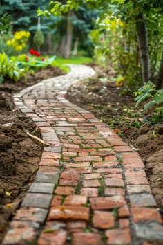 a brick path in the middle of a garden