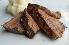 steak and mashed potatoes on a white plate