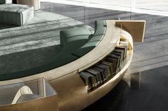 a table that has some books on it in front of a couch and coffee table