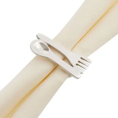 a white napkin with a fork on top of it and a knife sticking out of the napkin