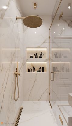 a bathroom with white marble walls and flooring, including a walk - in shower