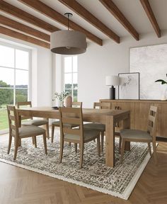 a dining room table and chairs in front of a large window with wooden beams on the ceiling