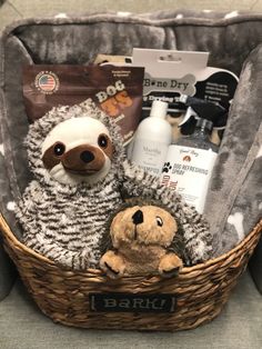 a stuffed animal sitting in a basket filled with personal care items