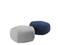 two small poufles sitting side by side, one blue and the other grey