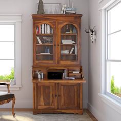 a wooden bookcase sitting in the corner of a room