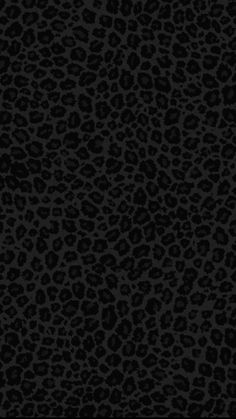 an animal print pattern in black and grey colors on a dark background for wallpaper