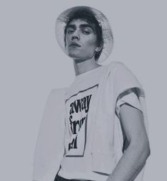 a young man wearing a white hat and t - shirt