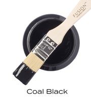 a paint brush with the words coal black on it