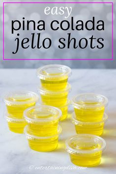 small plastic containers filled with yellow jello shots