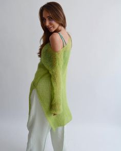 Hello, I'm the one, who won't let you down - lime green mohair tunic.I will comfort you, keep you warm and will make you smile. I'm 100% hand made and proud of that. I consist of 70% italian kid mohair and 30% of nylon, which makes me incredibly natural. I'm quite unique as could be worn all year long.I'm in one size and one size fits all because my measurements are :❤️   Width -50 cm❤️   Lengths -86 cmIf you would like me in other size, you could request a custom order with your own parameters, Spring Mohair V-neck Sweater, Green Knit Sweater For Layering, Summer Green Open Knit Sweater, Trendy Green Open Knit Sweater, Green Long Sleeve Summer Sweater, Oversized Asymmetrical Spring Sweater, Oversized Asymmetrical Sweater For Spring, Oversized Open Knit Green Sweater, Oversized Green Open Knit Sweater