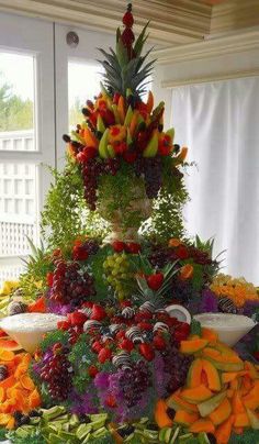 a large display of fruits and vegetables on a table