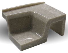 a small concrete chair sitting on top of a white floor