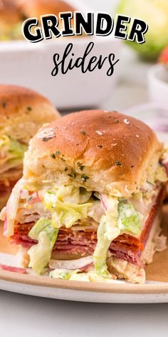 a close up of a sandwich on a plate with the words grinder slides above it