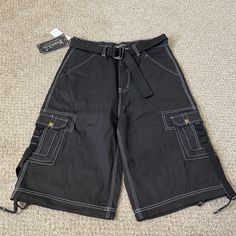 Possi Atti Cargo Shorts Mens 34* Skater Baggy Cinched Streetwear Y2k Urban New With Tags. Tagged 34, But Measurements Are Below. Cargo Shorts. Sku 0646 Measurements* Waist 32" Rise 13" Inseam 13" Leg Opening 12.5" Cheap Solid Color Cargo Shorts, Cheap Green Cargo Shorts, Masc Shorts, Streetwear Fashion Shorts, Grunge Shorts, Black Cargo Shorts, Underground Clothing, Emo Clothes, Silly Clothes