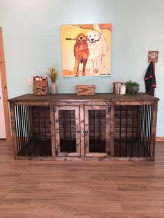 a dog kennel in front of a painting on the wall