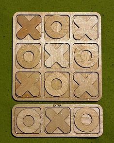 two pieces of wood that have letters and numbers on them, one is missing the letter x