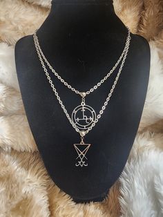 "Stainless steel Lilith and Lucifer sigil on stainless steel chains. Shortest length is 16\" and longest is 19\". Also available in 18\"/21\". When putting this necklace on, make sure chain is not twisted on either end or chains will tangle while wearing" Symbolic Metal Jewelry With Adjustable Chain, Spiritual Metal Jewelry With Silver Chain, Silver Double Strand Jewelry, Symbolic Metal Clavicle Chain Jewelry, Double Strand Necklace With Silver Chain, Double Strand Silver Chain Jewelry, Adjustable Nickel Free Stainless Steel Chain Necklace, Adjustable Silver Charm Necklace With Double Chain, Double Strand Silver Chain Necklace