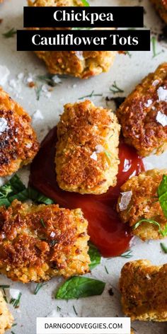 crab cakes with ketchup on top and the words chicken cauliflower tots above it