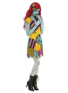 a woman with red hair and makeup is dressed in a costume that looks like she's holding her hands on her chest