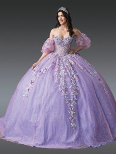 a woman in a purple ball gown with flowers on the bouncy skirt and sleeves