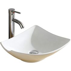 a white bowl sink sitting under a faucet