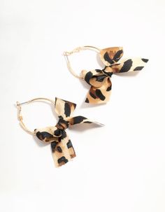 Unleash your wild side with these Cheetah Bow Fabric Hoop Earrings. Their fun mix of fabrics adds a bold pop of pattern to any outfit. Perfect for a night out, these eye-catching hoops will have all eyes on you. Material: Fabric Dimensions: Length 55 mm x Width 10 mm | Lovisa Cheetah Bow Fabric Hoop Earrings Fabric Hoop Earrings, Bow Fabric, Hoop Earrings Gold, All Eyes, All About Eyes, Earrings Gold, Night Out, Hoop Earrings, 10 Things