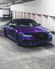 a purple sports car parked in a parking garage