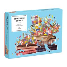 a puzzle box with books and butterflies on it's cover, in the shape of a boat