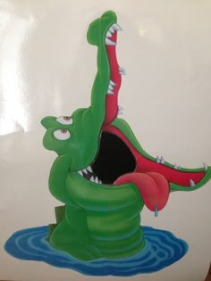 an image of a cartoon alligator in the water with its mouth open and tongue out