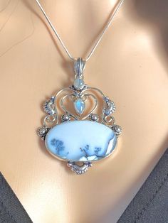 "Big and beautiful, vintage, one-of-a-kind piece, natural dendrite opal and rainbow moonstone pendant Necklace. Pendant set in oxidized, 925 sterling silver plated over copper, sizing: 2.90\" (including bail) x 2\" inches. 16\" inches long 925 sterling silver snake chain (chain's not oxidized). Total stone weight: 18.5 grams." Unique Iridescent Moonstone Jewelry, Moonstone Amulet Pendant Necklaces, Iridescent Moonstone Gemstone Necklace, Iridescent Moonstone Pendant Jewelry, Bloodstone Necklace, Chrysoprase Ring, Moonstone Pendant Necklace, Rainbow Moonstone Pendant, Silver Snake Chain