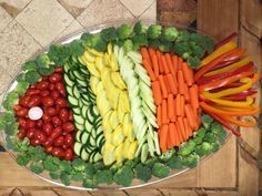 a platter filled with lots of different types of vegetables