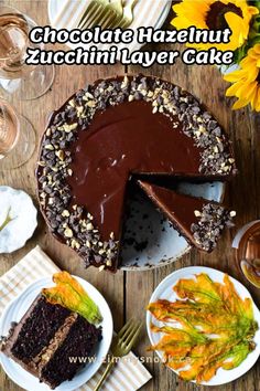 chocolate hazelnut zucchini layer cake on a wooden table with plates and forks