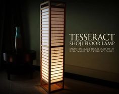 a tall lamp sitting on top of a wooden floor