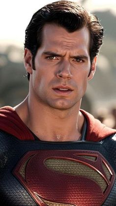 a close up of a person wearing a superman suit and looking at the camera with a serious look on his face