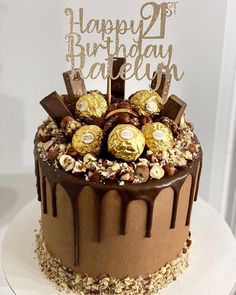 a birthday cake with chocolate and nuts on top