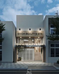 the front entrance to a salon and spa with stairs leading up to it's doors