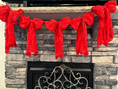 red tassels hanging from a fireplace mantel