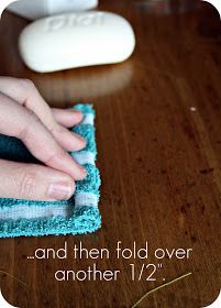 a person is cleaning a wooden table with a cloth on it and the words, and then fold over another 1 / 2