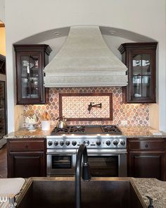 a stove top oven sitting inside of a kitchen