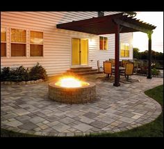 a fire pit sitting on top of a stone patio