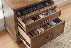 a computer desk with drawers and a keyboard