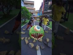 three different shots of people playing in the street, one with a fake monster's mouth