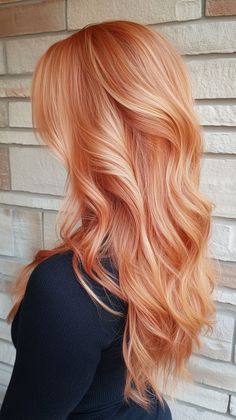 Warm up your style with copper peach hair that’s soft and beautiful. Visit our site for more inspiration on how to achieve this lovely transformation. Don’t forget to save this pin for your next hair inspiration! Peach Pumpkin Hair, Copper And Pink Hair, Copper Peach Hair, Peach Hair Color, Apricot Hair, Copper Blonde Hair Color, Peach Hair Colors, Pretty Red Hair, Copper Hair Color Ideas