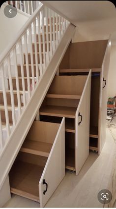 the stairs are being built into the wall next to the closet under the stair case