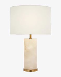 a table lamp with a white shade on it