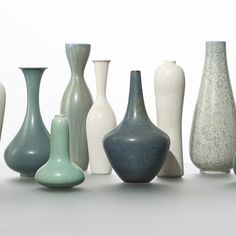 there are many different vases lined up together